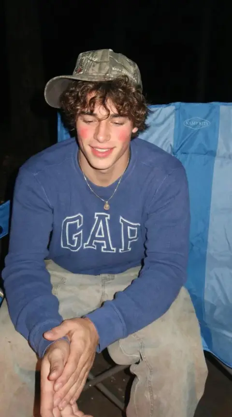 A cozy camping boy in the sunny forest
