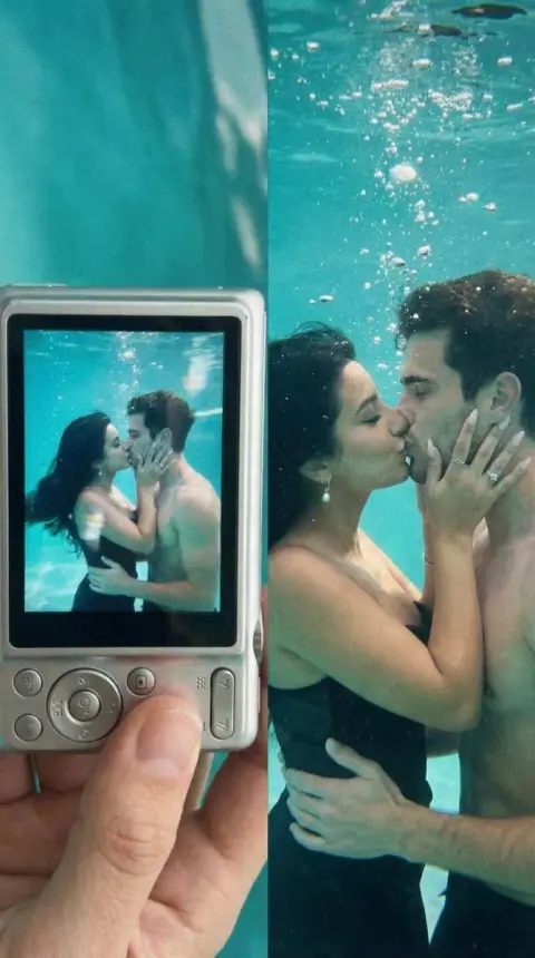 A romantic deep kiss underwater through a digital lens