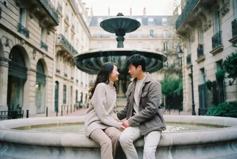 Affectionate lovers in a European-style ancient street in a cinematic symmetrical composition