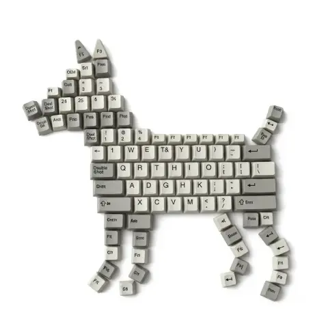 An overhead shot of a realistic puppy made of mechanical keycaps