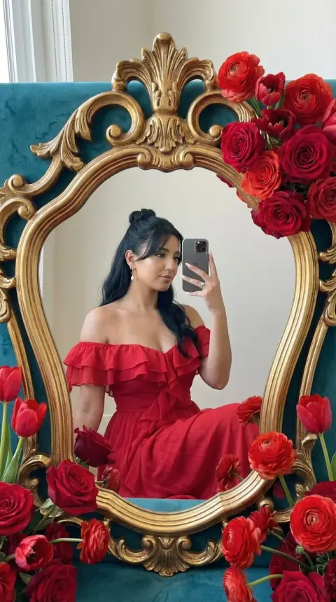 Baroque retro mirror girl surrounded by red roses