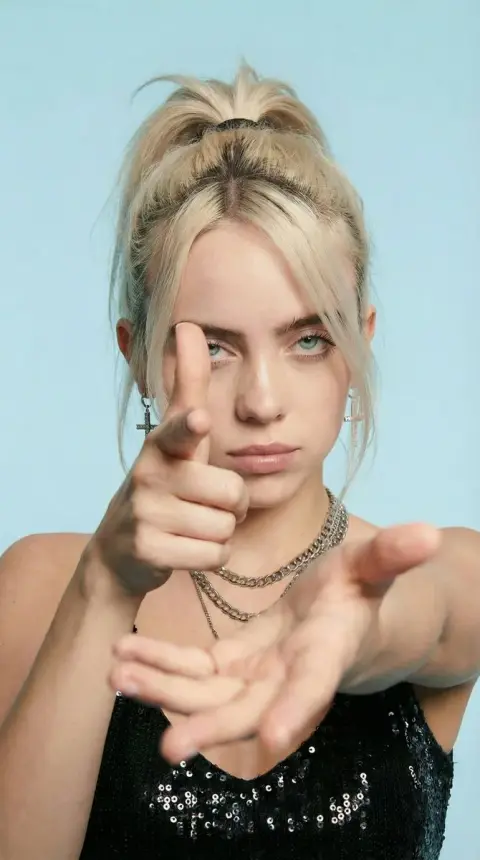 Beautiful close-up of pointing gun gesture under extreme perspective