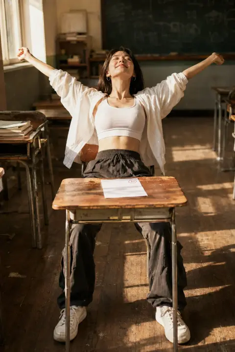 Cinematic portrait of Korean female stretching in classroom