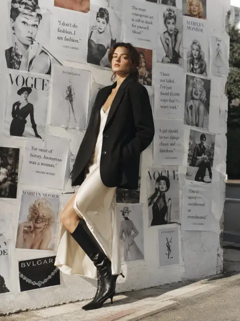 Cinematic retro portraits in front of Paris fashion pictorial wall