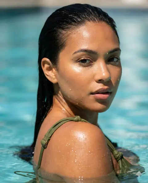 Close-up of a hibiscus-like olive green swimsuit under the sun
