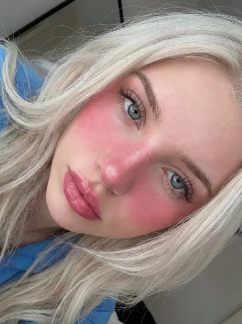 Close-up of sweet white-blonde girl under dreamy soft light