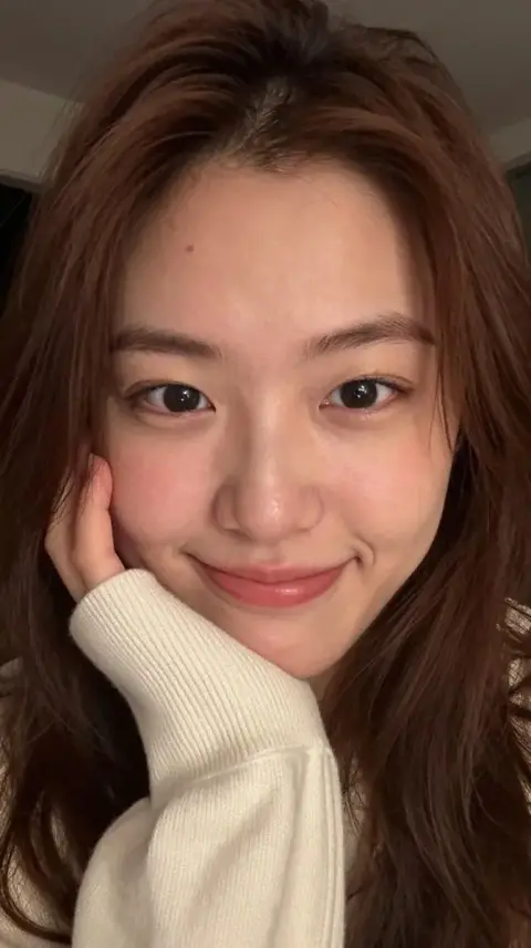 Close-up realistic selfie of young East Asian woman
