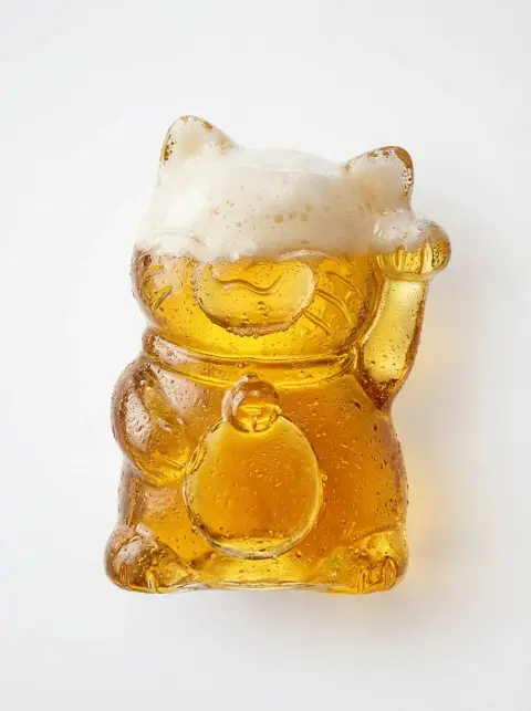 Coke amulet floating in minimalist light and shadow