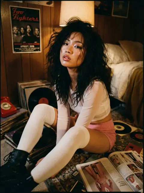 Confused and charming girl in retro bedroom