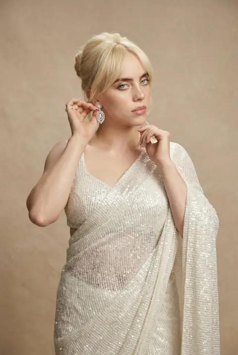Couture glamorous portrait in sparkling white sari