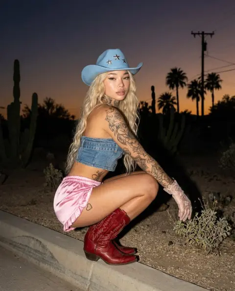 Cowboy fashion girl in twilight desert