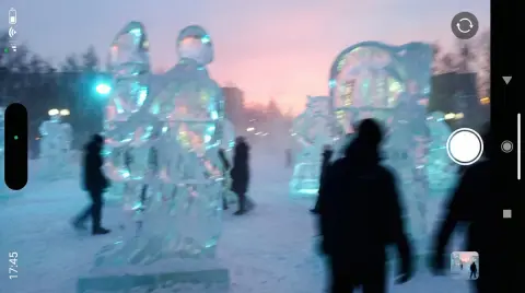 Documentary capture of ice sculptures in twilight and mist