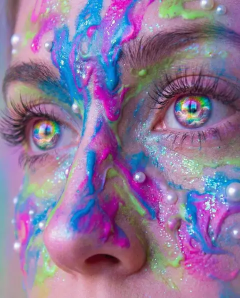 Fantasy facial close-up with psychedelic rainbow pupils