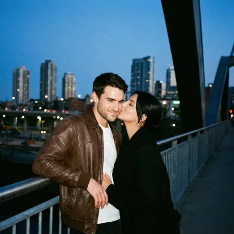 Film lovers kissing on the bridge under blue night sky