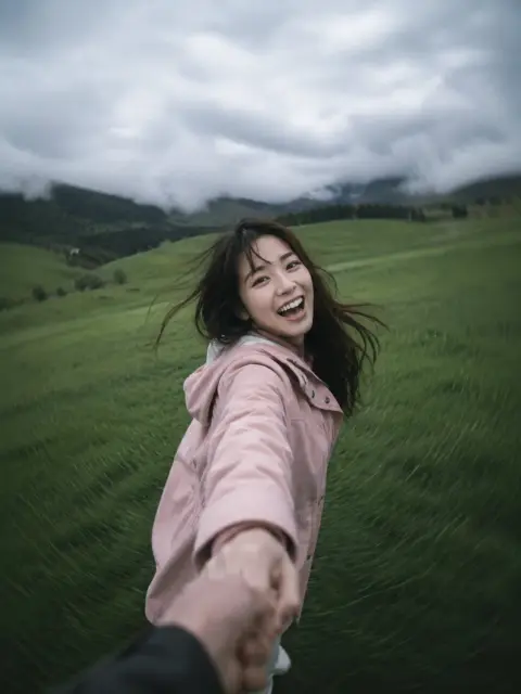 First perspective realistic photography of spinning and holding hands in the grass