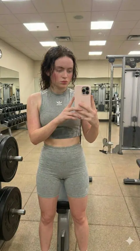 Fitness girl sweating through Adidas suit