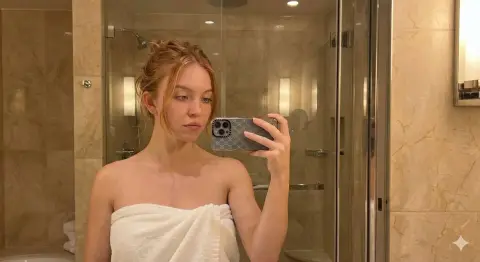 Freckled beauty in warm marble bathroom