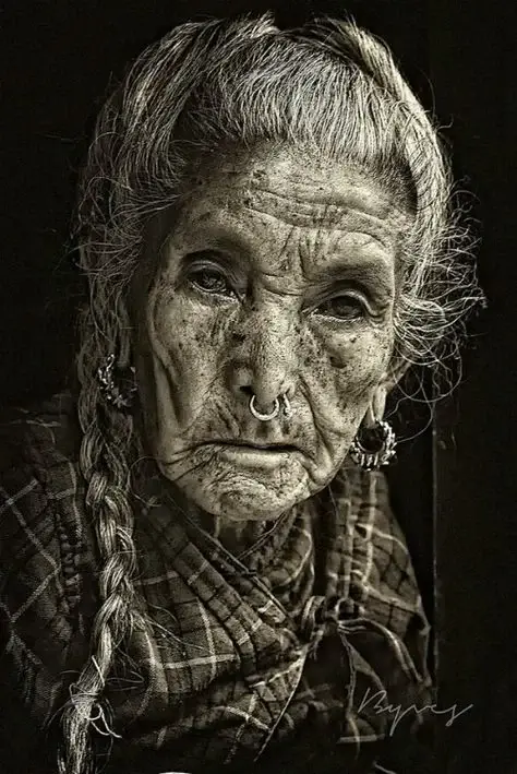 Girl with braided hair under charming black and white light and shadow