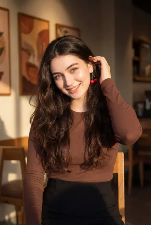 Girl with cherry earrings in the cafe
