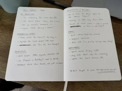 Handwritten notes with black ballpoint pen on desktop