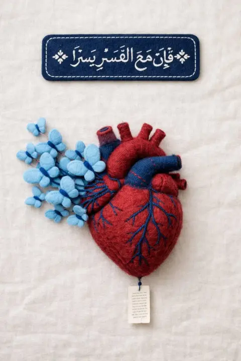 Healing felt heart with flying blue butterflies