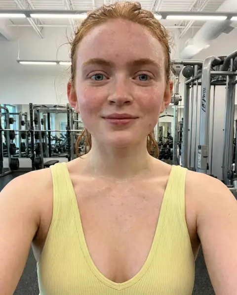 High-angle fitness selfie showing redness from sweating