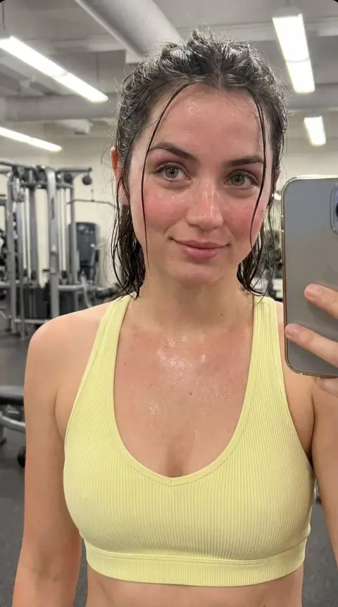 Intimate selfie in the gym shimmering with sweat