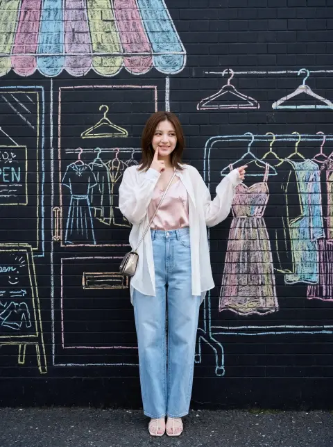Japanese fashion girl with hand-painted chalk background on the side street of Shimokitazawa