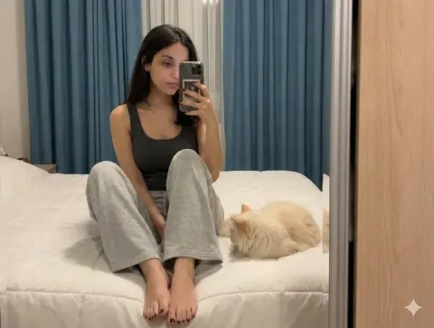 Lazy mirror selfie of long-haired girl and cat