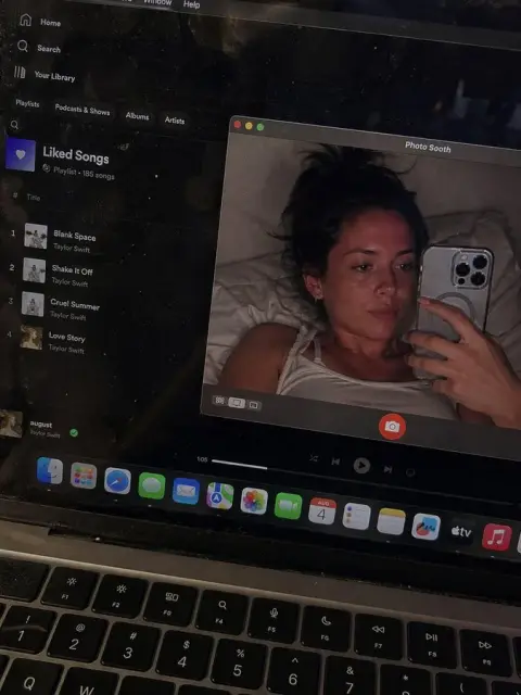Lazy selfie on laptop screen late at night