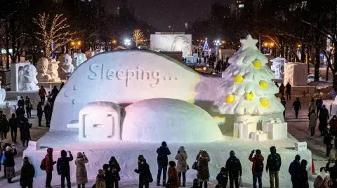 Lazy snow sculpture curled up in the kotatsu