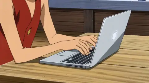 luffy coding on a macbook on the Thousand Sunny