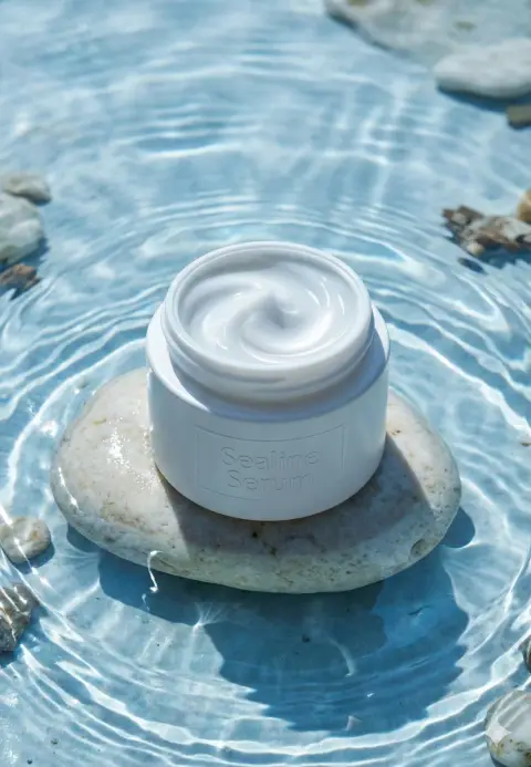 Minimalist skin care essence in clear water waves