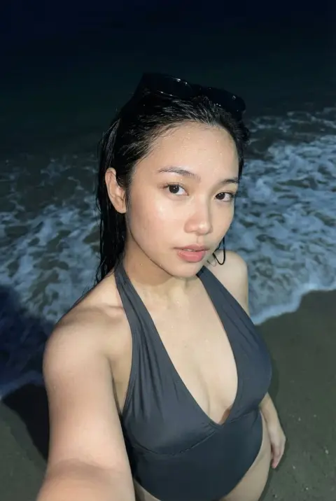 Moist gaze under flash lights at midnight beach