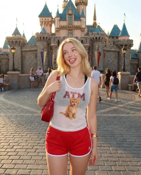 Playful girl in fairy tale castle at sunset