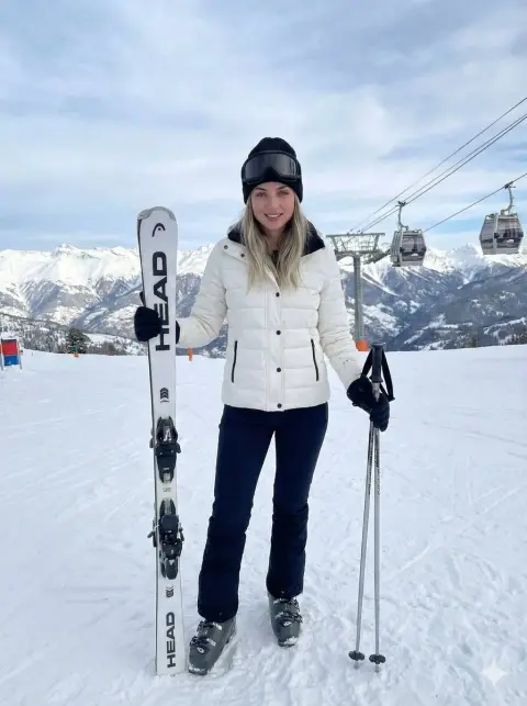 Realistic photography of the snow mountain skiing goddess under cinematic light and shadow