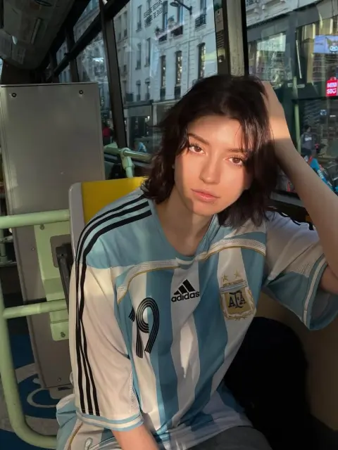 Realistic portrait of Argentina jersey boy in urban street shooting