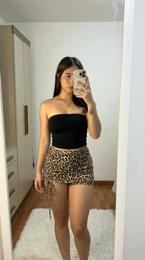 Selfie of leopard print tight outfit under ultra-realistic native camera