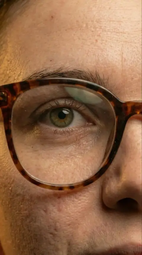 Super realistic girl in retro glasses close-up