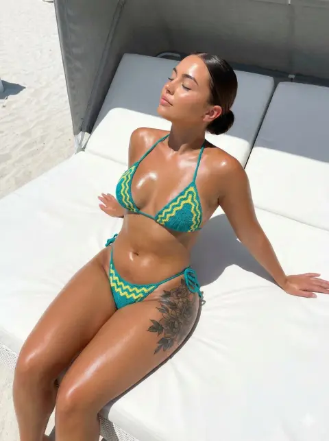 Tattooed hottie beach sunbathing photo
