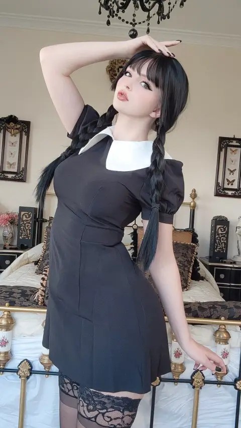 The charming posture of the dark night goth doll