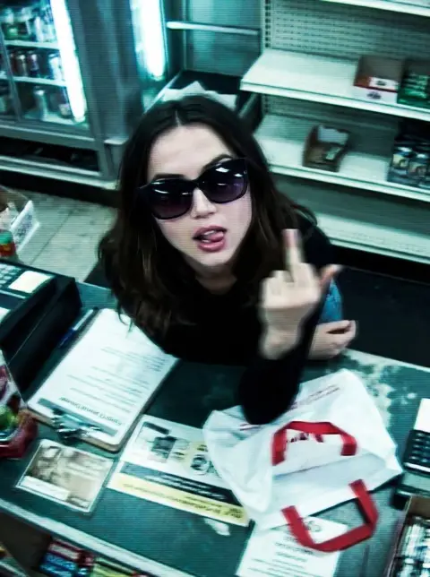 The rebellious moment of giving the middle finger from the perspective of surveillance