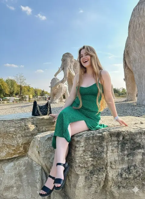 The smart girl next to the mammoth in the golden hour