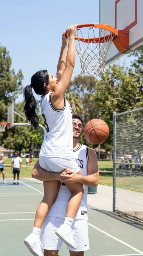 The wonderful moment when the boyfriend lifts his girlfriend up for a dunk at the Sunshine Stadium