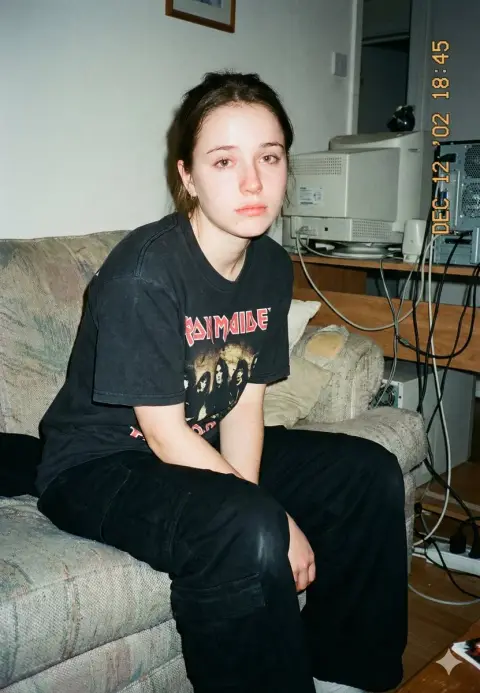 Tired girl under the direct camera lens of the millennium
