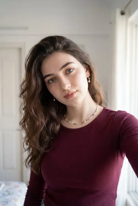 Warm selfie of burgundy knitted girl